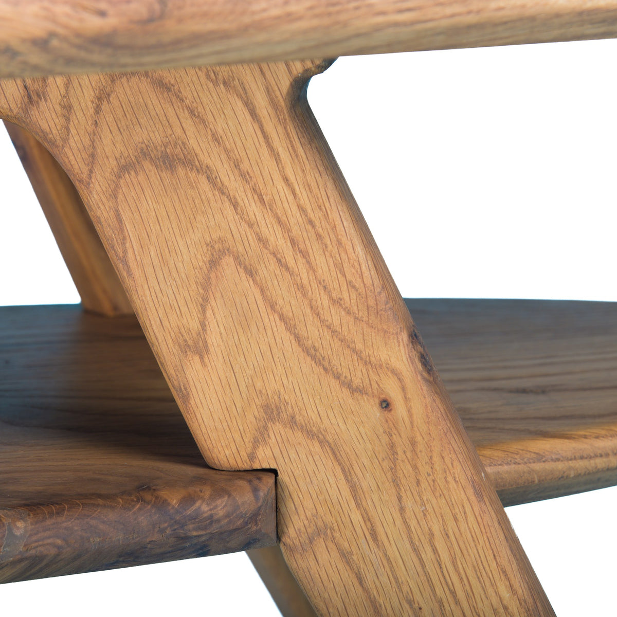 Dawn Patrol detail: an angled oak leg passing through the edge of the shelf