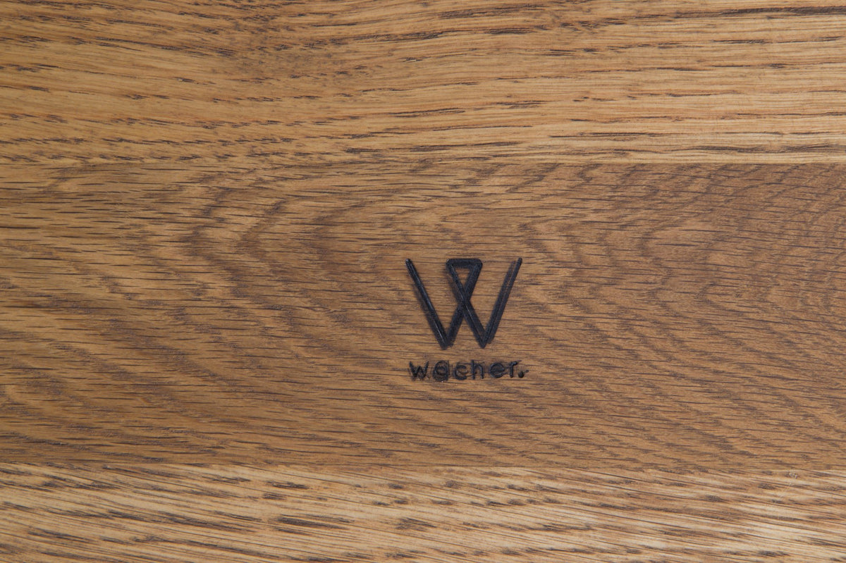 The Wacher.co mark on the underside of a table in solid oak, light finish